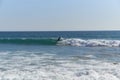 Surfer rides wave surfboard in Costa da Caparica Royalty Free Stock Photo