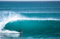 Surfer riding big wave in Bali Royalty Free Stock Photo