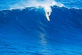 Surfer riding giant wave