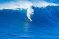 Surfer riding giant wave