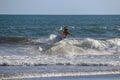 Surfer riding wave at Echo Beach Canggu Bali Indonesia