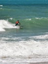 Surfer riding wave on the beach in Porto de Galinhas, Pernambuco, Brazil Royalty Free Stock Photo