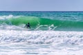 Surfer riding a wave in Lacanau, France