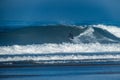 Surfer riding waves in Furadouro Beach