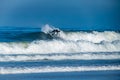 Surfer riding waves in Furadouro Beach