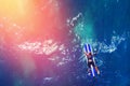 Surfer rows up to catch crest of wave in blue ocean sunlight. Concept surfing. Top view Royalty Free Stock Photo