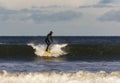 Surfer scene in Moray, Scotland, United Kingdom.