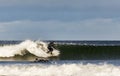 Surfer scene in Moray, Scotland, United Kingdom.