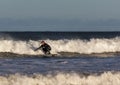 Surfer scene in Moray, Scotland, United Kingdom.