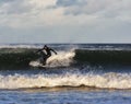 Surfer scene in Moray, Scotland, United Kingdom.