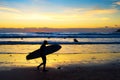 Surfer silhouette beach sunset Bali Royalty Free Stock Photo