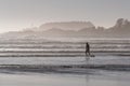 Surfer silhouette on Cox Bay beach, Tofino, Canada Royalty Free Stock Photo