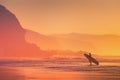 Surfer silhouette at sunset