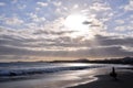 Surfer at sunset on a calm ocean Royalty Free Stock Photo