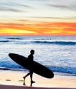 Surfer at sunset, Portugal Royalty Free Stock Photo