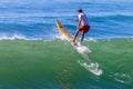 Surfer SUP Over Wave Royalty Free Stock Photo