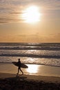 Surfer with surf board on beach, Fistral Bay, UK Royalty Free Stock Photo