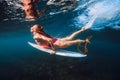 Surfer with surf board dive underwater with under big ocean wave Royalty Free Stock Photo