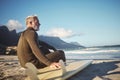 Surfer, surfboard and senior man on beach for surfing adventure trip waiting for sea waves in nature for water sports