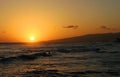 Surfer Surfing during a Hawaiian Sunset Royalty Free Stock Photo