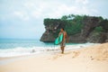 Surfer. Surfing Man With Surfboard Walking On Sandy tropical Beach. Healthy Lifestyle, water activities, Water Sport. Beautiful Royalty Free Stock Photo