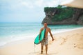 Surfer. Surfing Man With Surfboard Walking On Sandy tropical Beach. Healthy Lifestyle, water activities, Water Sport. Beautiful Royalty Free Stock Photo