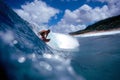 Surfer Surfing on the North Shore in Blue Hawaii Royalty Free Stock Photo