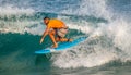 Surfer surfing with waves