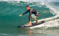 Surfer surfing with waves