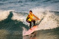 Surfer surfing with waves