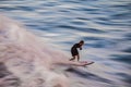 Surfer taking his last ride in