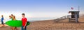 Surfer teen boys girls walking on California beach Royalty Free Stock Photo