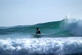 Surfer turning on a wave