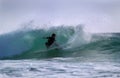 Surfer turning on a wave