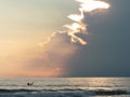 Surfer waiting for ocean waves in a overcast evening Royalty Free Stock Photo