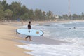 Surfer walking on the beach