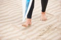 Surfer, walking or feet on beach sand with surfboard on vacation for fitness training, wellness or travel. Legs of Royalty Free Stock Photo