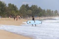 Surfer walking out of the water