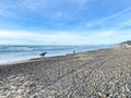 Surfer walking with their boards on Torrey Pines State Beach before sunset twilight Royalty Free Stock Photo