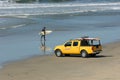 Surfer Walks Beach