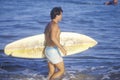 Surfer in water with board, Sunset beach, Malibu, CA