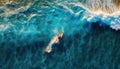 Surfer on the wave in Hawaii aerial beautiful blue ocean, top view