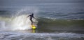 Surfer on wave at sandbar where the Santa Clara River empties into the Pacific Ocean at Ventura California U Royalty Free Stock Photo