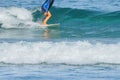 Surfer on the wave. The surfer leaves the pipe. Waves on the island Taken from the water. The surfer catches the wave