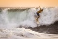 Surfer on wild Ocean Wave in Bali Royalty Free Stock Photo