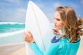 Surfer woman on the beach Royalty Free Stock Photo