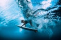 Surfer woman dive underwater. Surfgirl dive under big wave Royalty Free Stock Photo