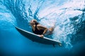 Surfer woman dive underwater. Surfgirl dive under wave Royalty Free Stock Photo