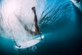 Surfer woman dive underwater with under waves Royalty Free Stock Photo