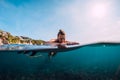 Surfer woman relax and floating with surfboard. Surfgirl in ocean.